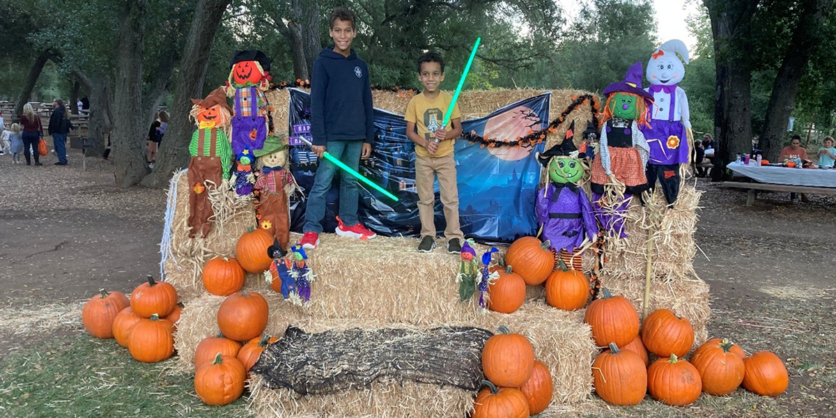 Dos Picos Halloween Festival - Posing with hay bales